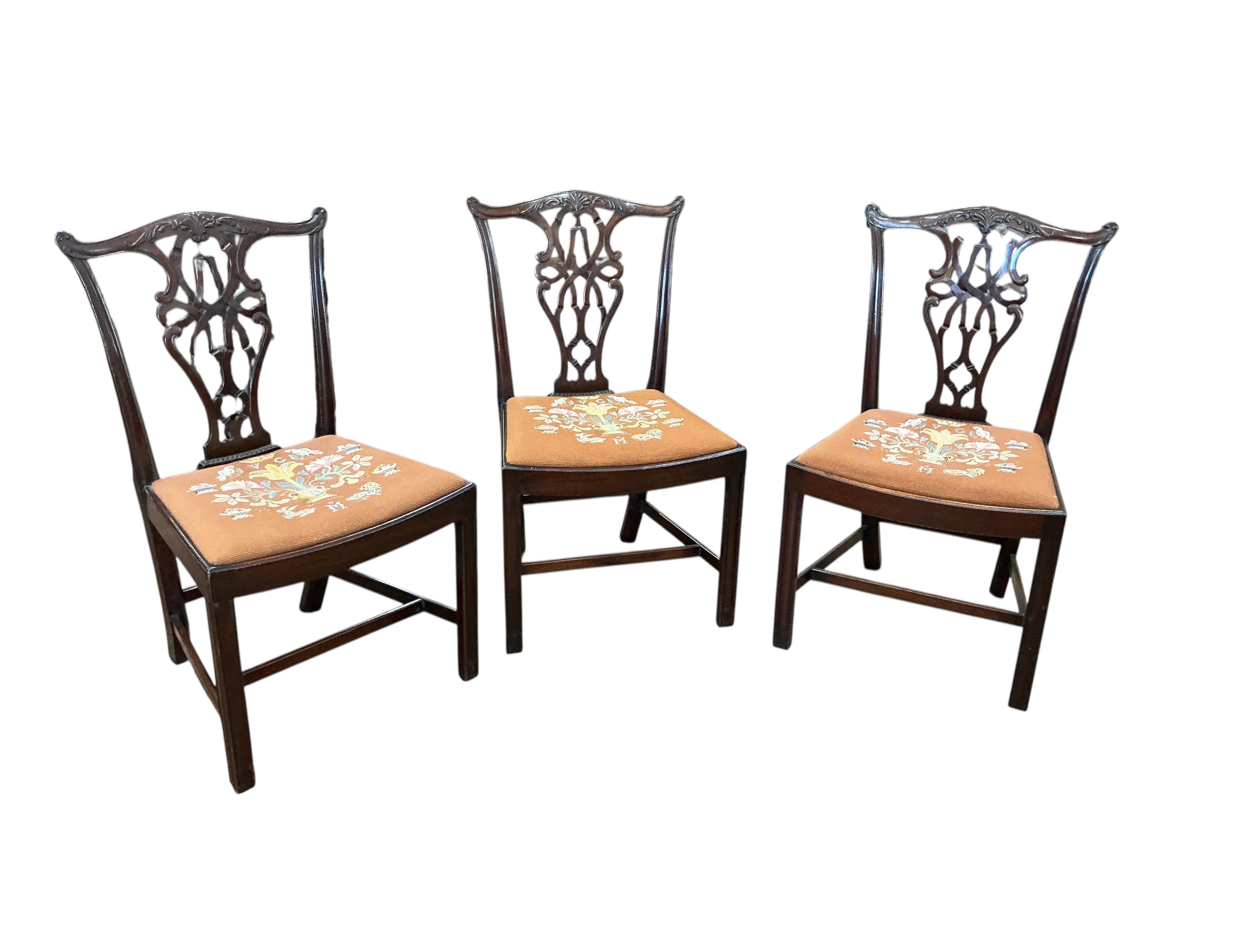 A Victorian style mahogany extending dining table, width 226cm extended, two spare leaves together with a set of eight Chippendale Revival mahogany dining chairs, two with arms
